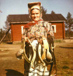 Skolt Sami woman with reindeer collar.jpg